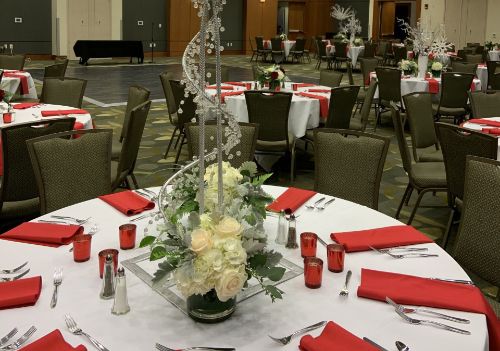 Festively decorated Christmas banquet table with holiday centerpieces
